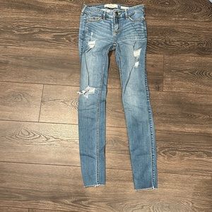 Hollister medium wash distressed low rise super skinny jeans size 0r